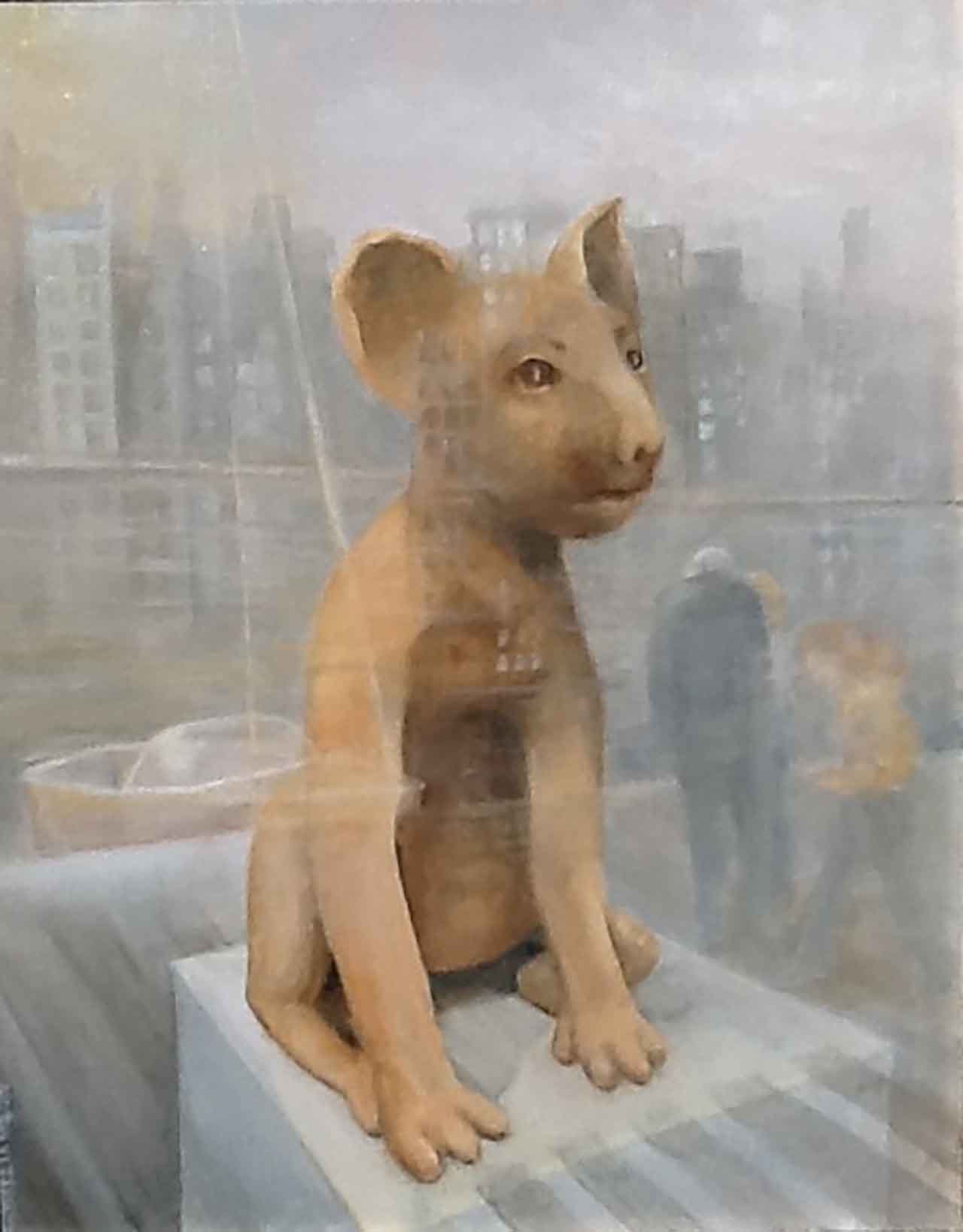 Oil painting of a statue in a shop window with the city reflected in the glass.. Painted by Carol Williamson.